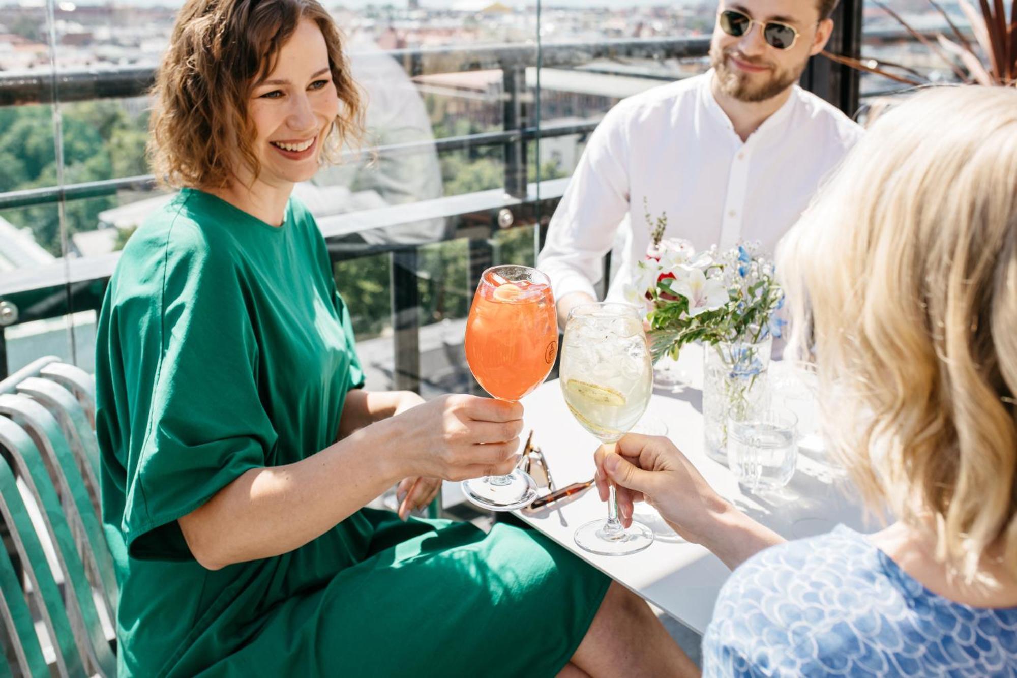 Solo Sokos Hotel Torni Helsinki Exterior photo A woman drinking a Bellini